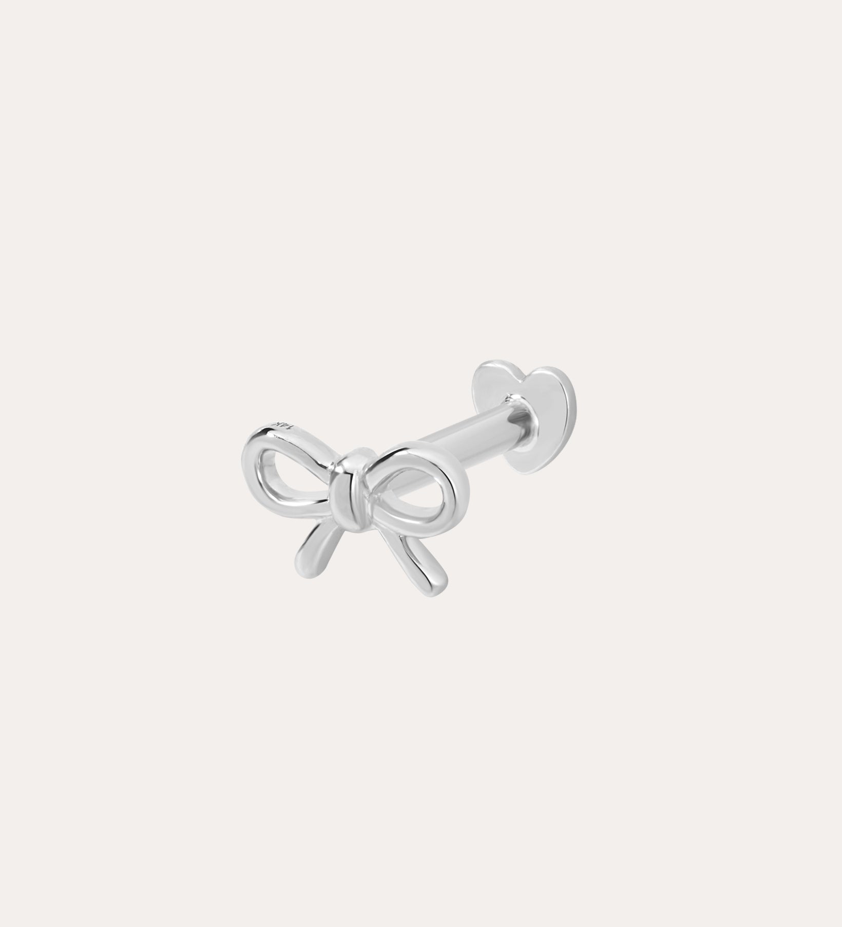 The 14K Solid White Gold Bow Tie Flat Back Stud, in 14K white gold, features a delicate bow front and heart-shaped flat back, shown on a plain white background.