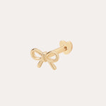 The 14K Solid Yellow Gold Bow Tie Flat Back Stud is a small earring with a heart-shaped flat back, elegantly displayed on a plain light background.