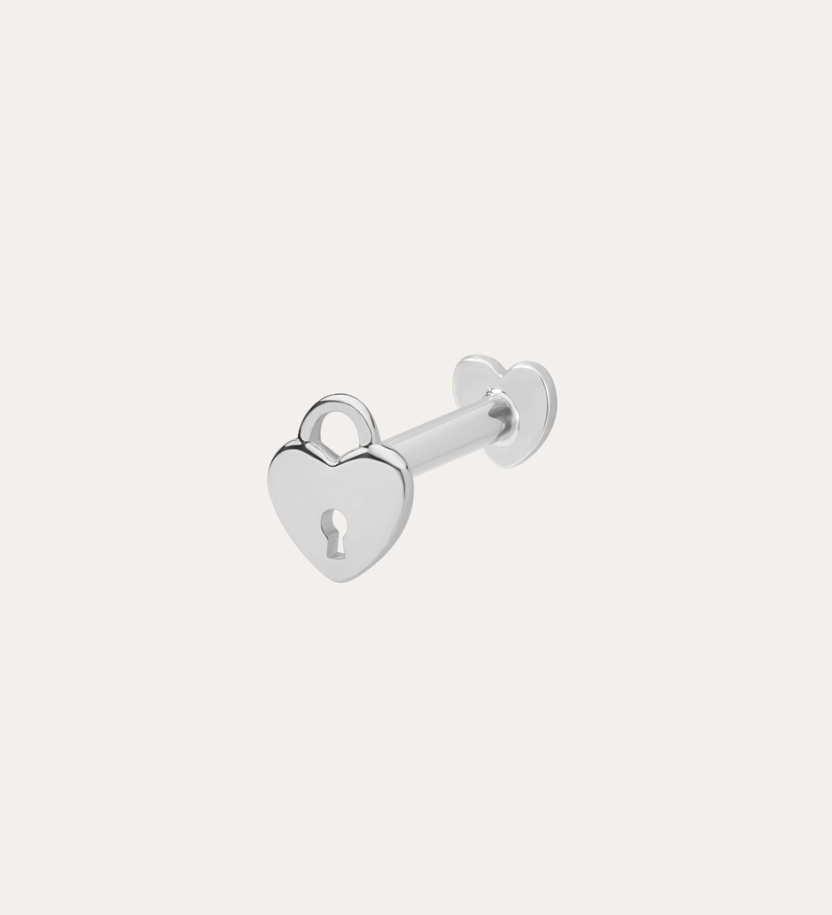 The 14K Solid White Gold Lock Flat Back Stud features a heart-shaped padlock with a central keyhole design, set against a plain white background—an elegant addition to your body jewellery collection.