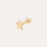 The 14K Solid Yellow Gold Star Flat Back Stud features a five-pointed star design in gleaming 14K yellow gold, making it a striking celestial ear accessory against any plain, light background.