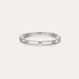 The Aisha Paperclip Stacking Ring in Silver showcases a sleek, open geometric link design and is displayed against a simple light backdrop.