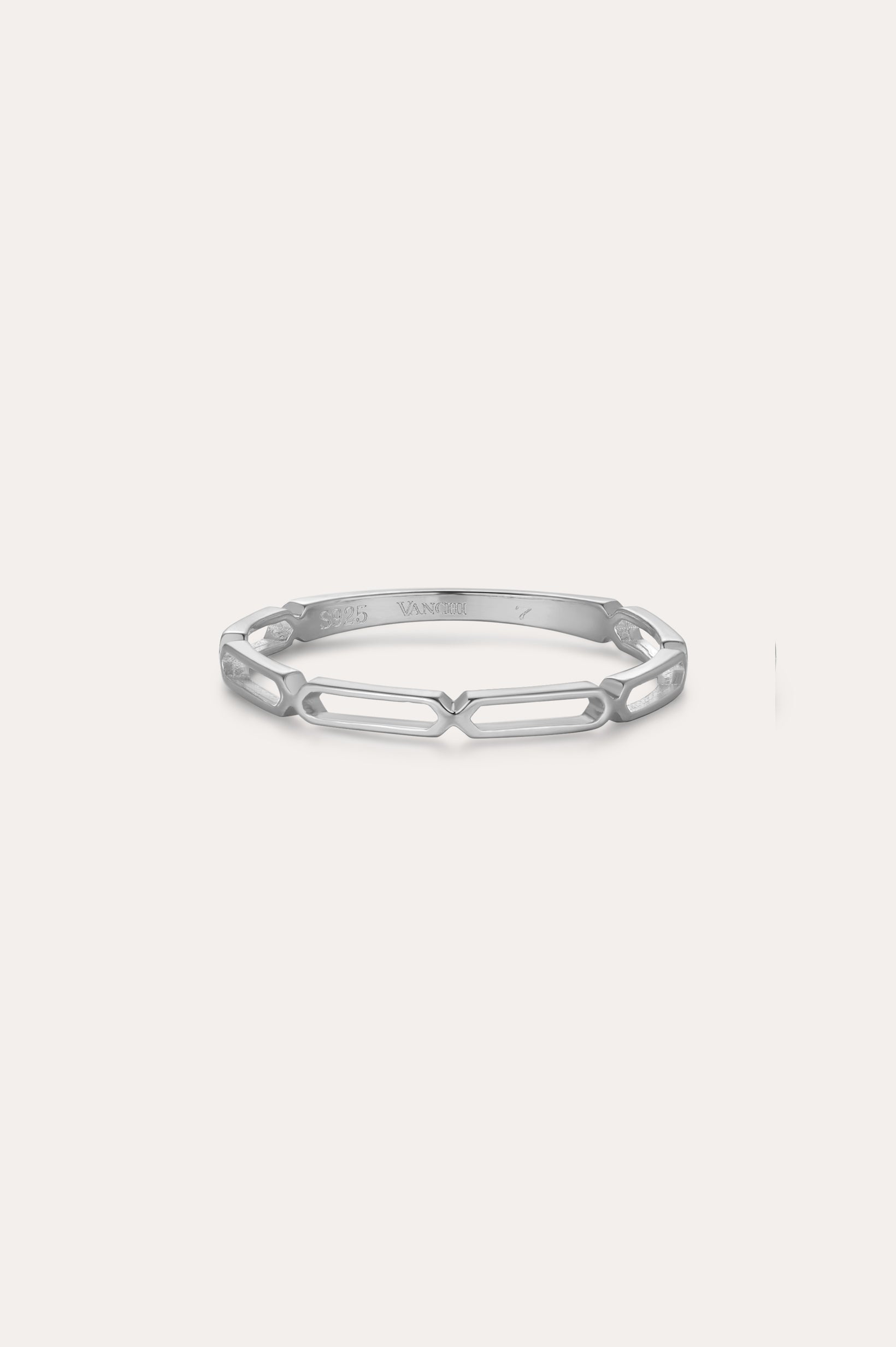 The Aisha Paperclip Stacking Ring in Silver showcases a sleek, open geometric link design and is displayed against a simple light backdrop.