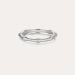 The Bamboo Ring in Silver is a slender band crafted from recycled sterling silver, featuring subtle joint details and showcased on a plain light background.