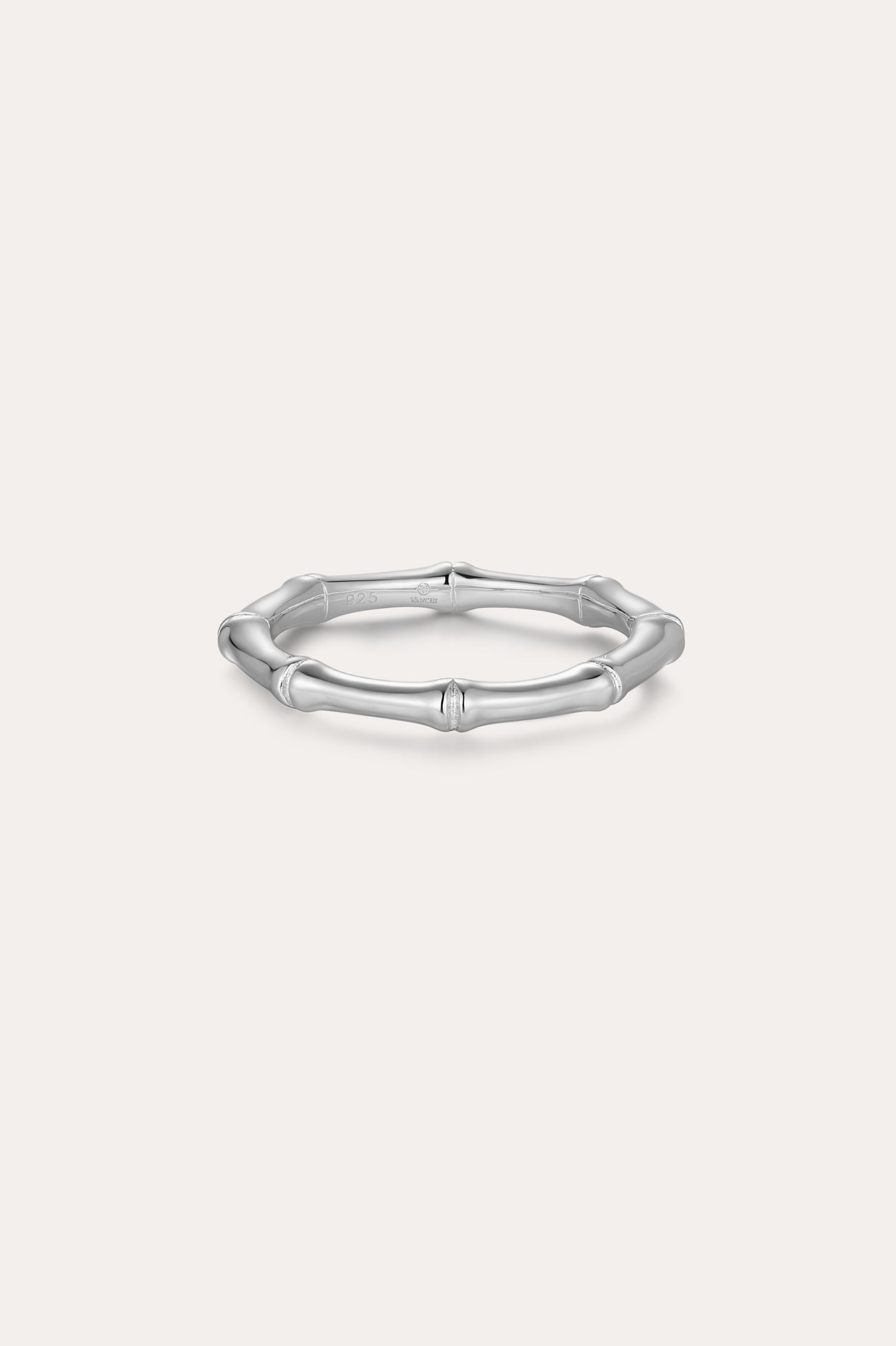 The Bamboo Ring in Silver is a slender band crafted from recycled sterling silver, featuring subtle joint details and showcased on a plain light background.