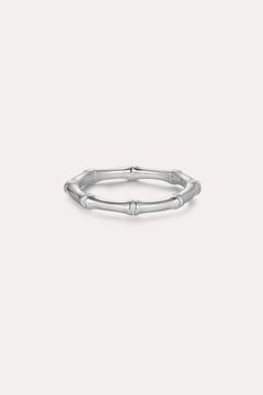 The Bamboo Ring in Silver is a slender band crafted from recycled sterling silver, featuring subtle joint details and showcased on a plain light background.