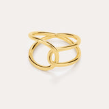The Ayla Link Ring in Gold features an open, intertwined double-band design for a modern, elegant look, showcased against a plain, light background.