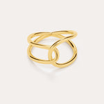 The Ayla Link Ring in Gold features a modern, intertwined double-band design plated in 18k gold, creating an elegant and minimalist loop pattern against a plain light background.
