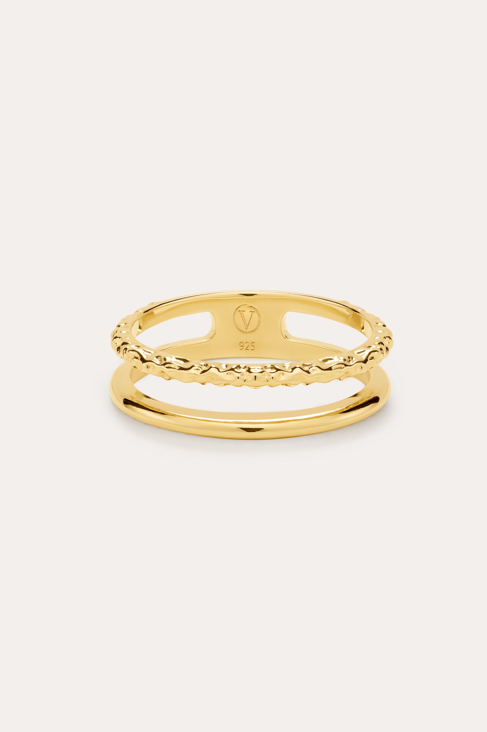 The Molten Double Band Ring in Gold, crafted in 18k gold plated with smooth and twisted rope bands, is elegantly displayed against a light background.