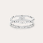The Molten Crystal Double Band Ring in Sterling Silver features one band with clear cubic zirconia stones and another with a twisted rope design, shown on a light background.