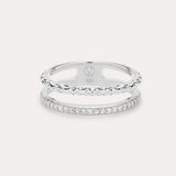 The Molten Crystal Double Band Ring in Sterling Silver features one band with clear cubic zirconia stones and another with a twisted rope design, shown on a light background.