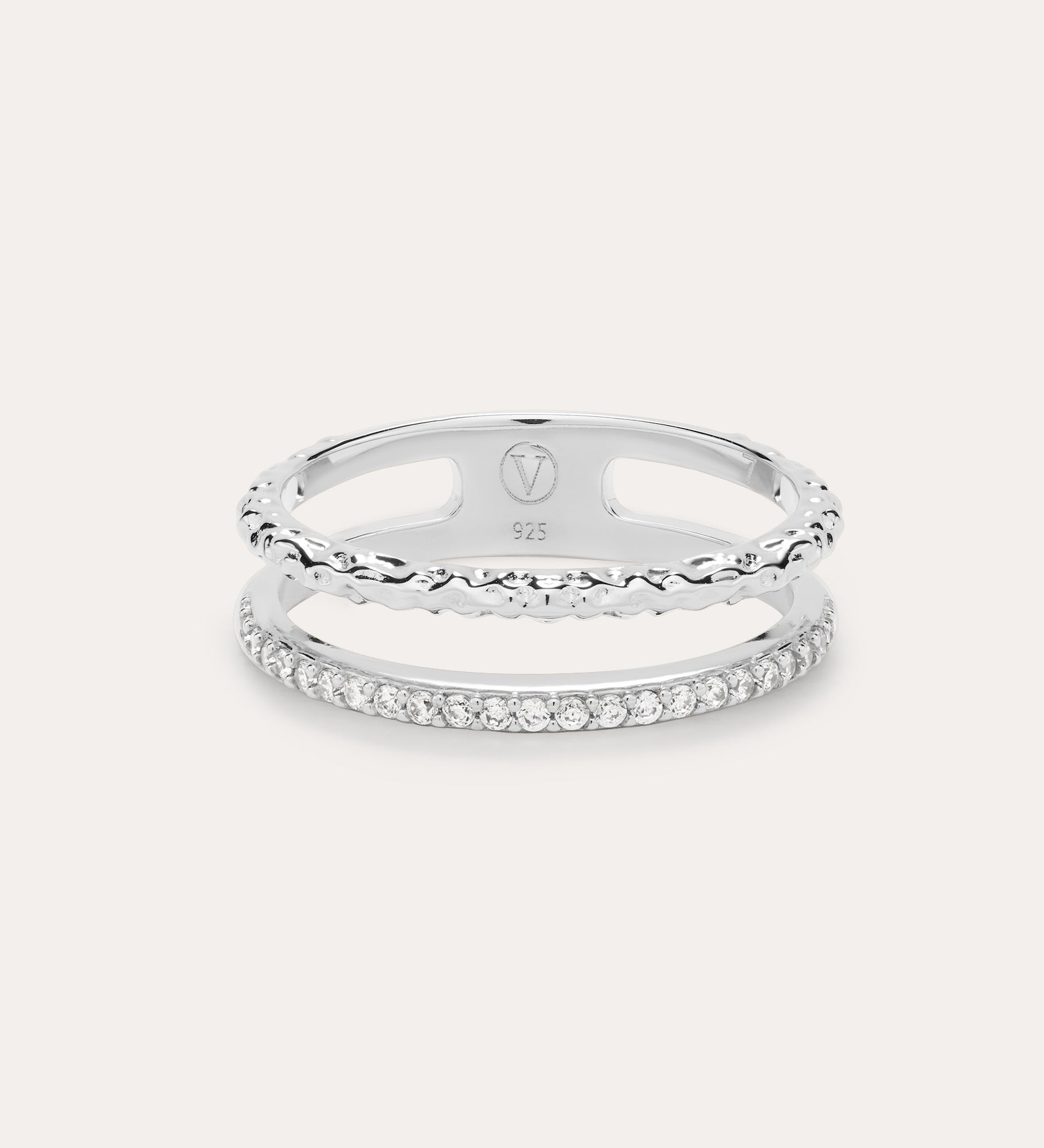 The Molten Crystal Double Band Ring in Sterling Silver features one band with clear cubic zirconia stones and another with a twisted rope design, shown on a light background.