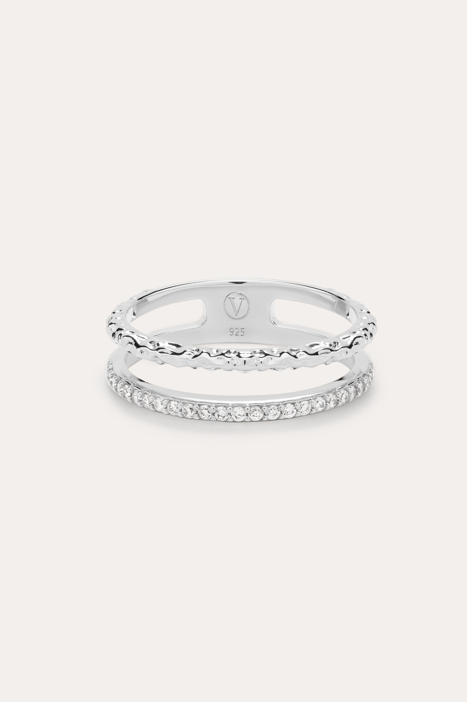 The Molten Crystal Double Band Ring in Sterling Silver features one band with clear cubic zirconia stones and another with a twisted rope design, shown on a light background.