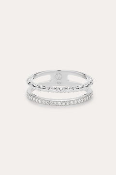 The Molten Crystal Double Band Ring in Sterling Silver features one band with clear cubic zirconia stones and another with a twisted rope design, shown on a light background.