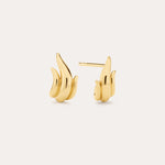 A pair of Flame Stud Earrings in Gold with a sculptural, flame-inspired design and 18k gold plated finish are shown on a light background—one facing forward and the other displaying the side and post.