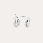 Flame Stud Earrings in Silver, crafted in sterling silver and shaped like stylized flames, are shown on a plain light background with one front view and one side view—ideal for fans of modern jewellery.