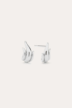 Flame Stud Earrings in Silver, crafted in sterling silver and shaped like stylized flames, are shown on a plain light background with one front view and one side view—ideal for fans of modern jewellery.