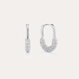 The Nouf Pavé Hoop Earrings in Sterling Silver, partially adorned with sparkling cubic zirconia, are shown on a plain light background—one earring displayed from the front, the other from the side.