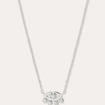 The Defender Evil Eye Necklace in Sterling Silver features an eye-shaped pendant with a central gemstone and four dangling gems, combining elegance and protective charm, shown against a plain white background.