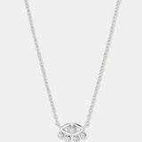 The Defender Evil Eye Necklace in Sterling Silver features an eye-shaped pendant with a central gemstone and four dangling gems, combining elegance and protective charm, shown against a plain white background.