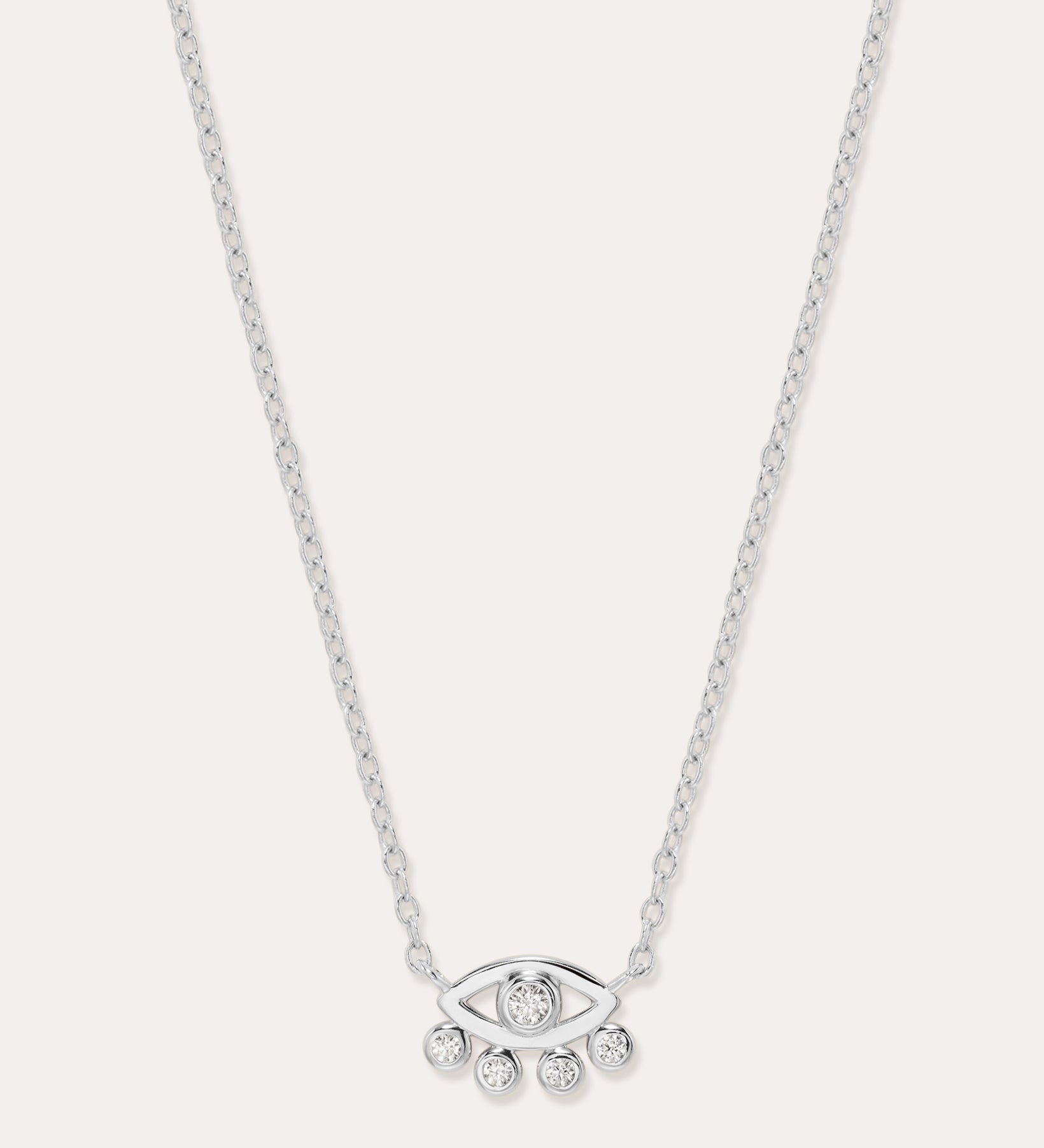 The Defender Evil Eye Necklace in Sterling Silver features an eye-shaped pendant with a central gemstone and four dangling gems, combining elegance and protective charm, shown against a plain white background.