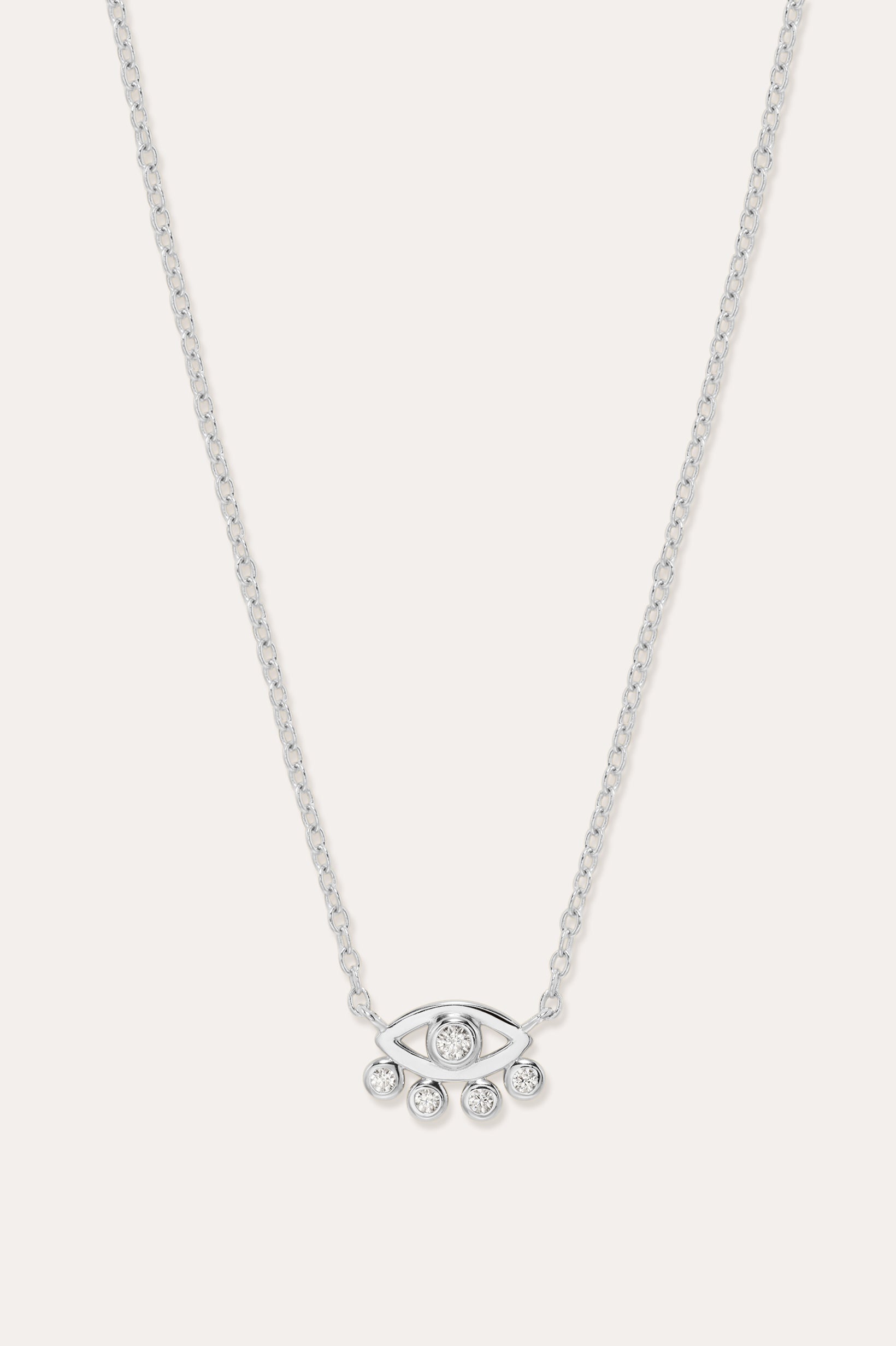 The Defender Evil Eye Necklace in Sterling Silver features an eye-shaped pendant with a central gemstone and four dangling gems, combining elegance and protective charm, shown against a plain white background.