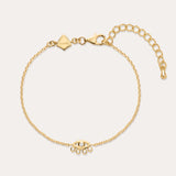 The Defender Evil Eye Bracelet in Gold features an 18k gold-plated finish, an eye-shaped cubic zirconia charm with three dangling crystals, and an adjustable lobster clasp closure.