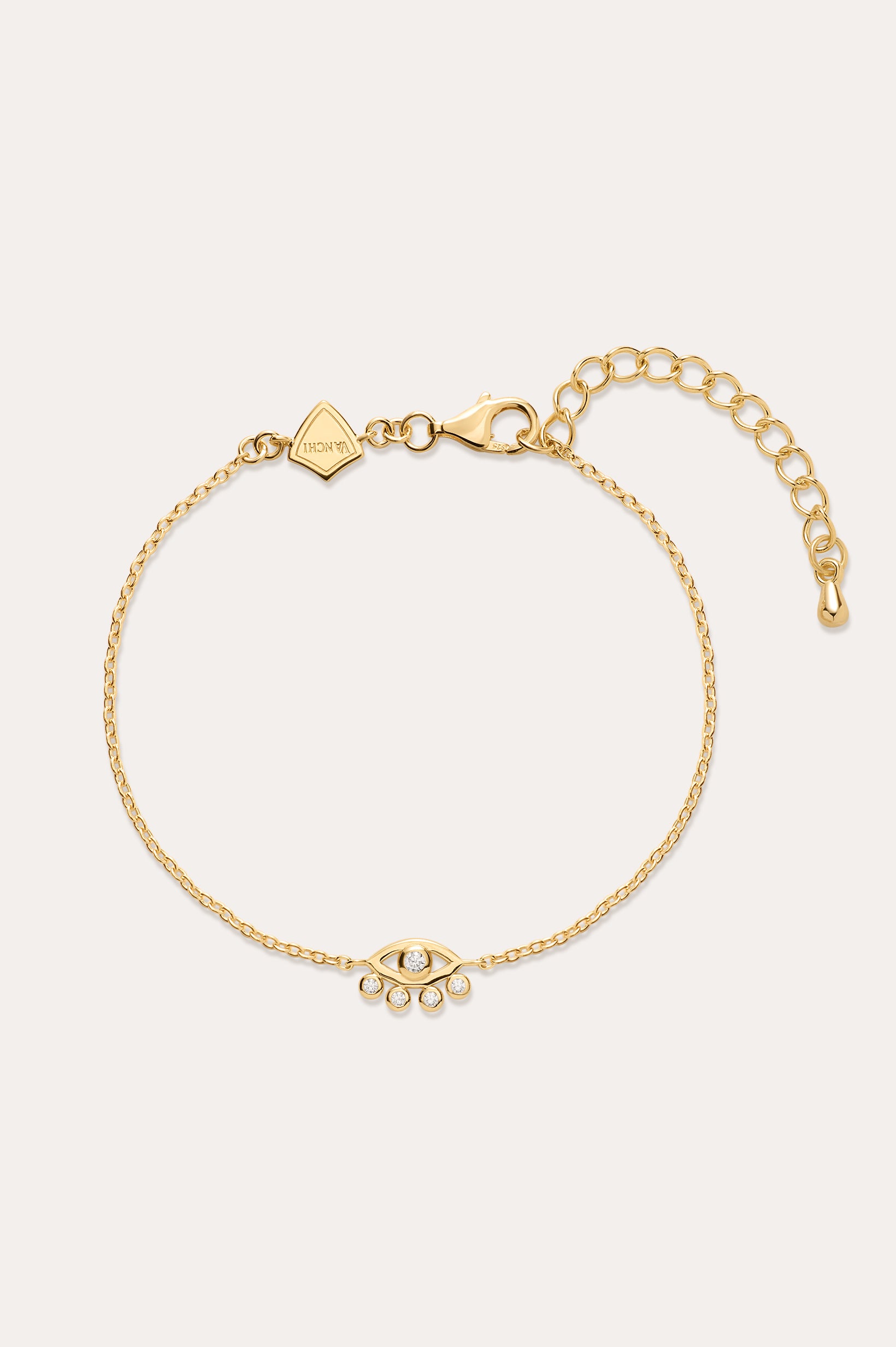 The Defender Evil Eye Bracelet in Gold features an 18k gold-plated finish, an eye-shaped cubic zirconia charm with three dangling crystals, and an adjustable lobster clasp closure.