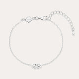 The Defender Evil Eye Bracelet in Sterling Silver features a central charm with clear cubic zirconia, an adjustable extension chain, lobster clasp, and a small square tag near the clasp.