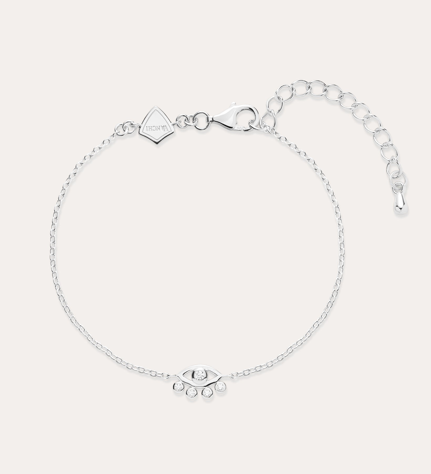 The Defender Evil Eye Bracelet in Sterling Silver features a central charm with clear cubic zirconia, an adjustable extension chain, lobster clasp, and a small square tag near the clasp.