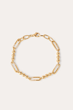 The Carly Paperclip Chain Bead Bracelet in Gold features alternating large 18k gold plated links, some adorned with sparkling cubic zirconia and sections of round gold beads, finished with a lobster clasp.