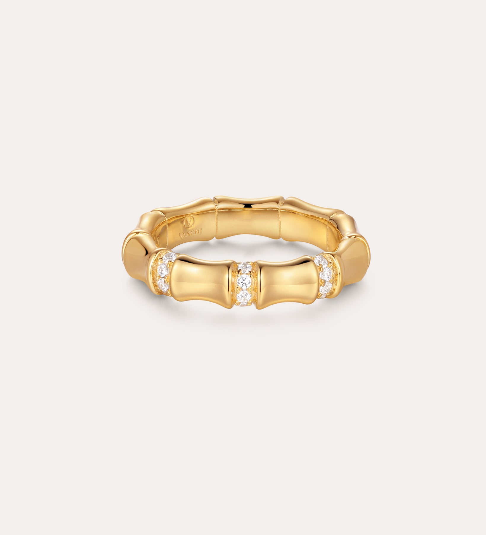 The Bamboo Chunky Crystal Ring in Gold, crafted to mimic bamboo stalks and accented with three sparkling crystal clusters, is made from recycled sterling silver finished in radiant gold and displayed on a simple light background.