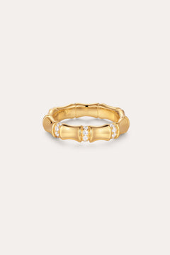 The Bamboo Chunky Crystal Ring in Gold, crafted to mimic bamboo stalks and accented with three sparkling crystal clusters, is made from recycled sterling silver finished in radiant gold and displayed on a simple light background.