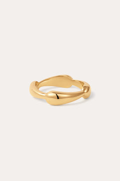 The Colette Link Droop Ring in Gold, featuring a wavy, organic design, is displayed against a simple, light background.