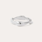 The Colette Link Droop Ring in Silver features a minimalist design with a smooth, slightly irregular band and rounded ends, shown against a light background.