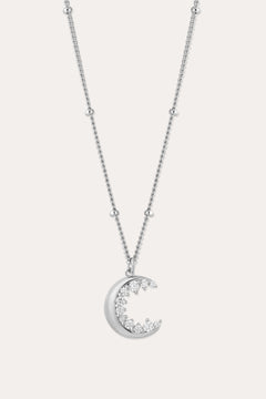 The Crescent Moon Crystal Charm Beaded Necklace in Silver features a delicate beaded chain and a crescent moon pendant adorned with sparkling clear stones.