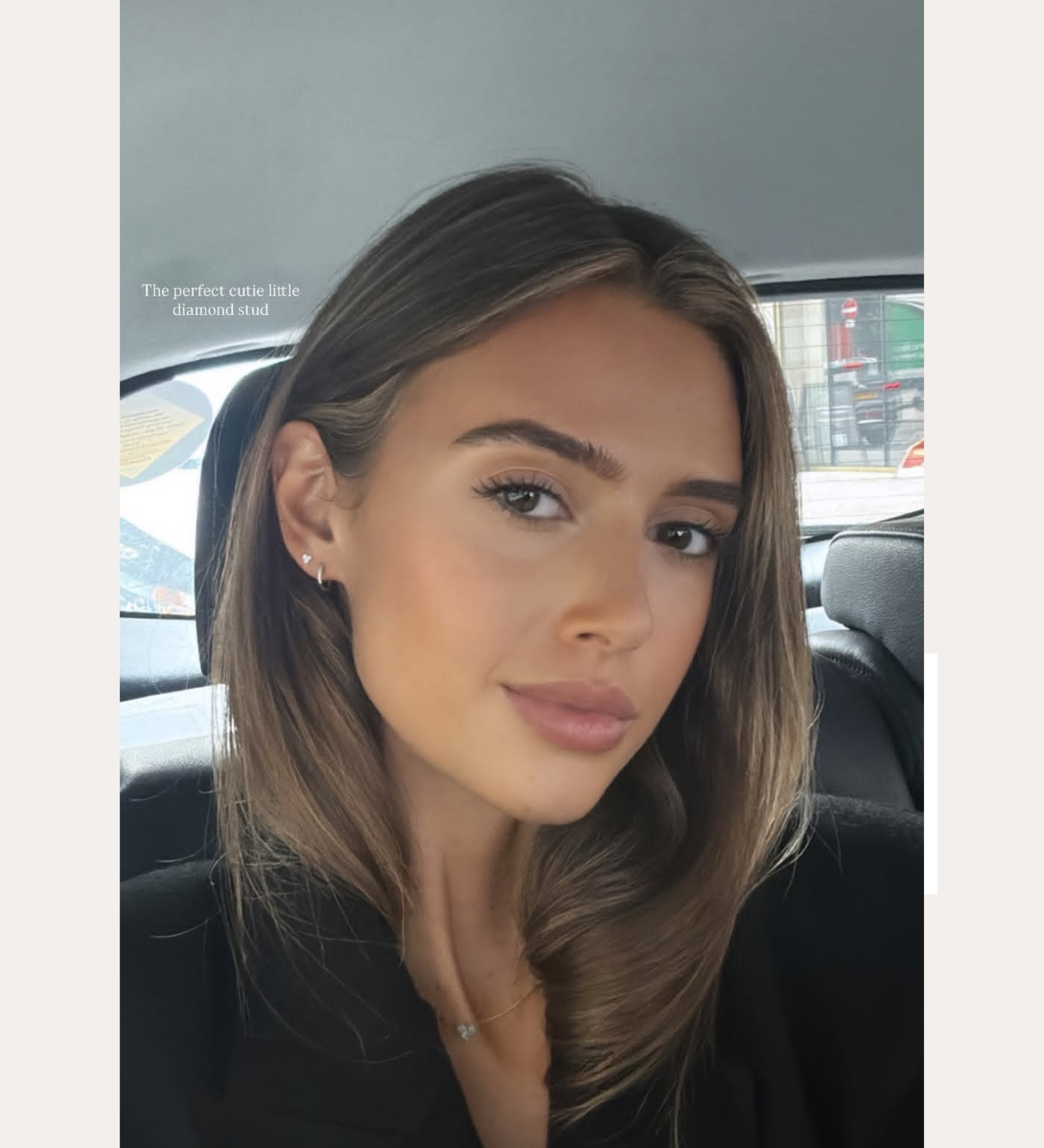 A young woman with straight brown hair and natural makeup sits in a car’s backseat, wearing a black top and a 14K Solid Yellow Gold Lab-Grown Diamond Trinity Flat Back Stud. Text above reads, “SPOTTED ON: DANI OLIVIA NEWMAN.”.