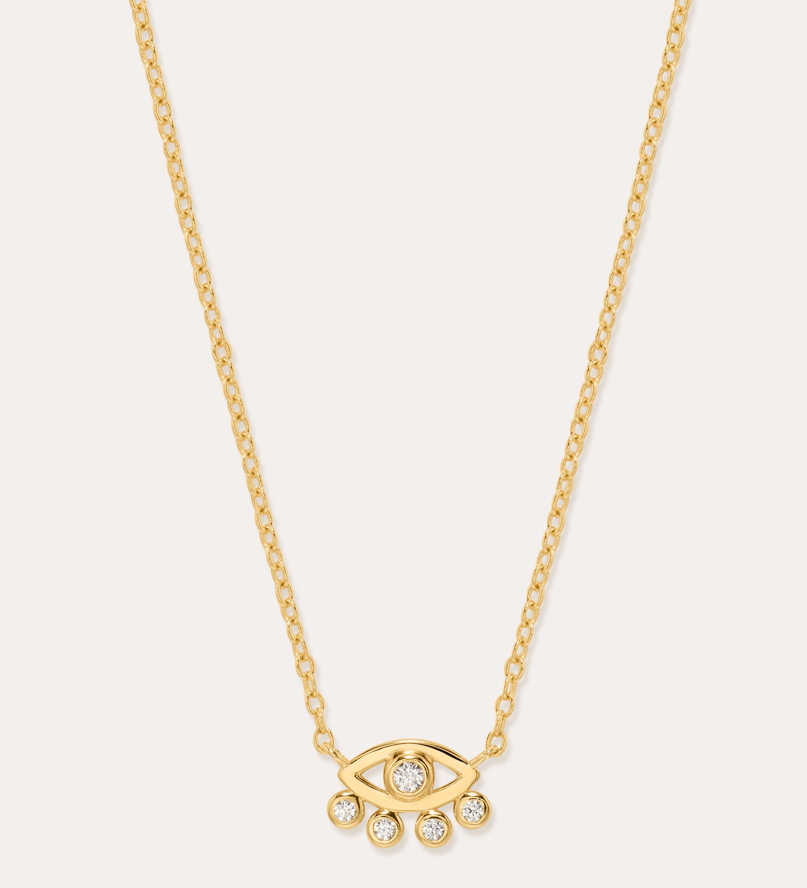The Defender Evil Eye Necklace in Gold features an 18k gold-plated eye-shaped pendant with a central cubic zirconia and four dangling crystals, shown on a plain white background.