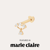 The 14K Solid Yellow Gold Freda Lab-grown Diamond Flat Back Stud, featuring three round diamonds and a dangling diamond, is shown above "Featured in marie claire" on a light background.