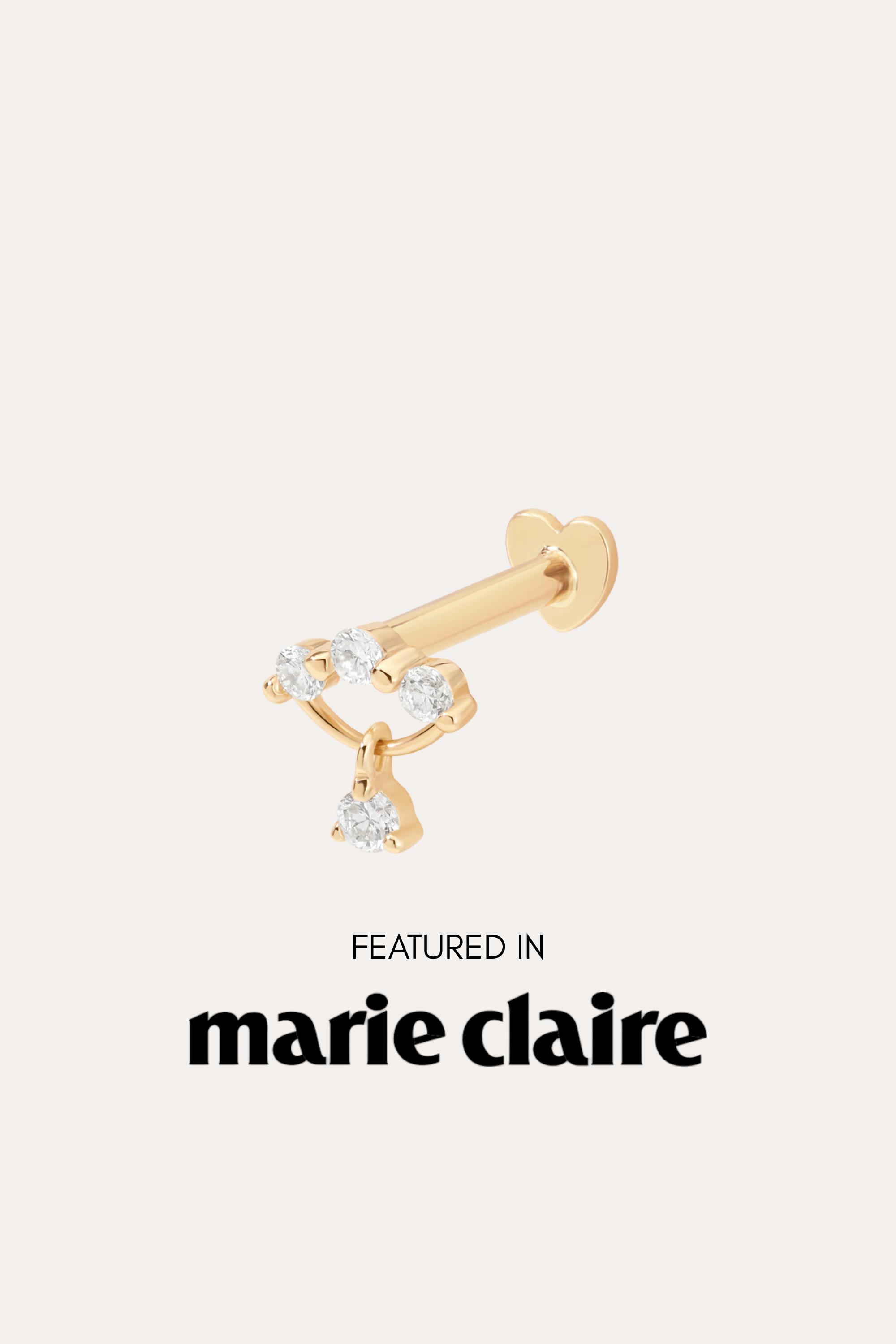 The 14K Solid Yellow Gold Freda Lab-grown Diamond Flat Back Stud, featuring three round diamonds and a dangling diamond, is shown above "Featured in marie claire" on a light background.