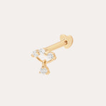 The 14K Solid Yellow Gold Freda Lab-grown Diamond Flat Back Stud features three small round gemstones in a curved line and a dangling lab-grown diamond, all in 14K yellow gold, shown against a plain light background.