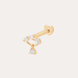 The 14K Solid Yellow Gold Freda Lab-grown Diamond Flat Back Stud features three small round gemstones in a curved line and a dangling lab-grown diamond, all in 14K yellow gold, shown against a plain light background.