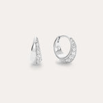 The Georgie Crystal Knife Edge Huggie Hoop Earrings in Silver feature a row of sparkling white stones, shown on a plain light background with one earring displayed from the front and the other from the side.