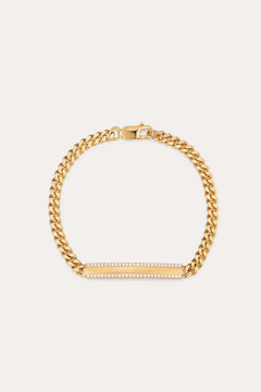 The Gisèle Cuban Link Bar Bracelet in Gold features a gold-plated chain, a lobster clasp, and a horizontal rectangular bar embellished with small sparkling clear stones.