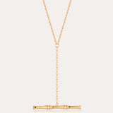 The Bamboo Chain Y-Bar Lariat Necklace in Gold features a delicate Y-shaped chain ending in a horizontal gold bar, accented with sparkling gemstones.