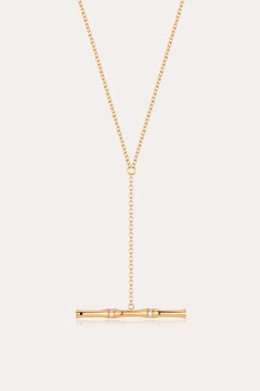 The Bamboo Chain Y-Bar Lariat Necklace in Gold features a delicate Y-shaped chain ending in a horizontal gold bar, accented with sparkling gemstones.