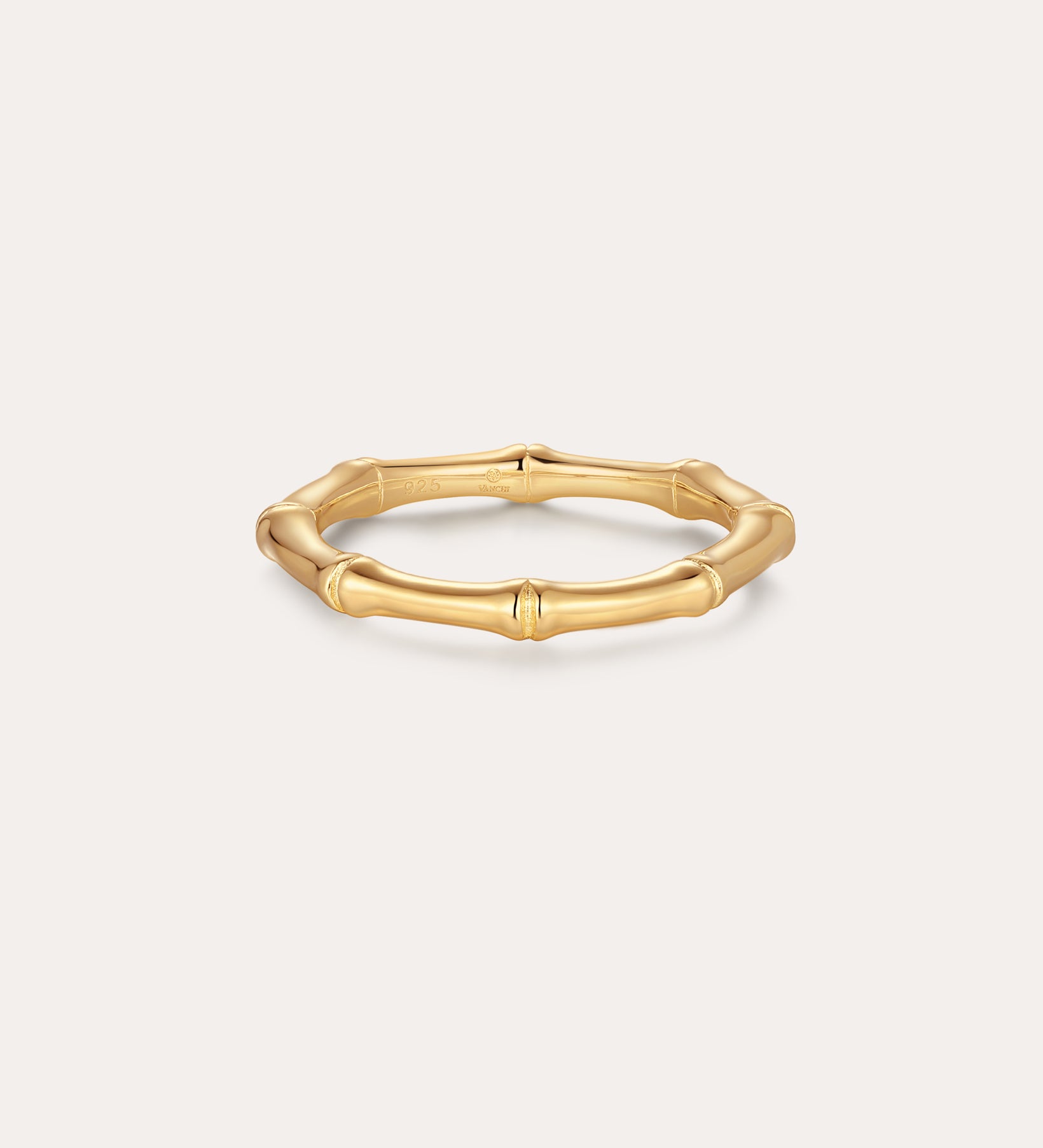 The Bamboo Ring in Gold features smooth, rounded segments in a slim, gold-plated design—perfect for minimalist jewelry lovers and shown on a simple light background.
