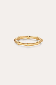 The Bamboo Ring in Gold features smooth, rounded segments in a slim, gold-plated design—perfect for minimalist jewelry lovers and shown on a simple light background.