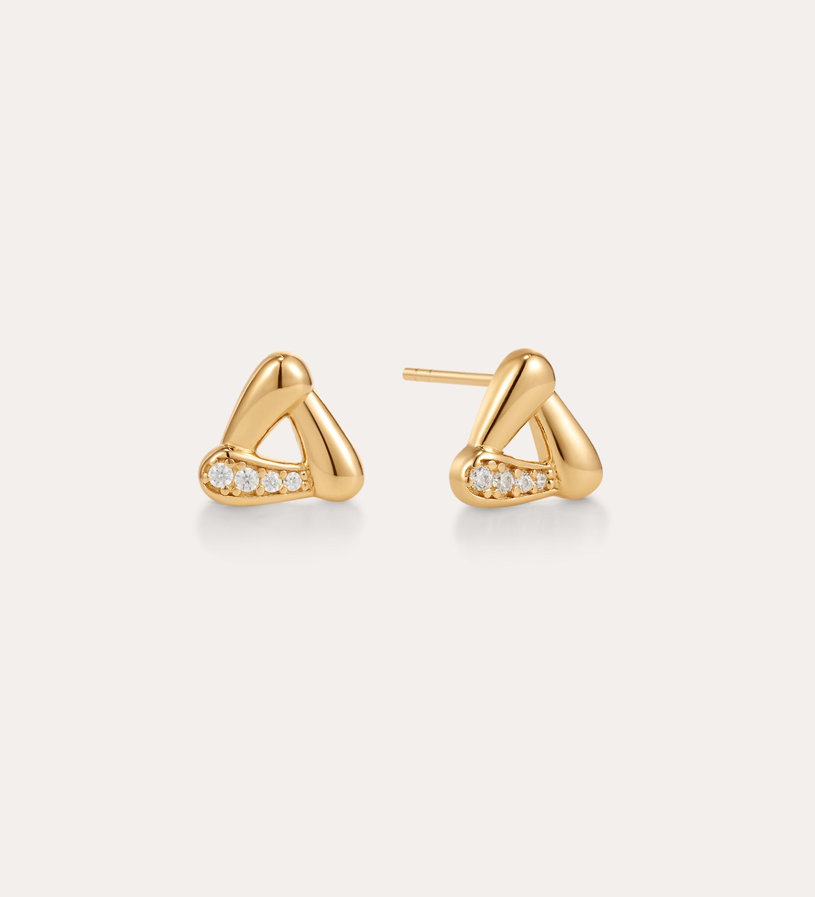 A pair of Colette Droop Link Studs in Gold, designed in a rounded triangular shape with three small diamonds set along one side, displayed on a plain light background.