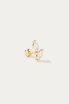 The Flora Barbell Stud in Gold is a butterfly-shaped earring with two clear marquise-cut cubic zirconia wings, shown on a plain white background.