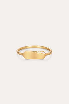 The Ines Horizontal Bar Ring in Gold features a flat, elongated plate adorned with a cluster of small sparkling diamonds on one side, shown against a plain white background.